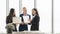 Smiling business woman colleague teamwork cheer up in officeÂ and standing near window